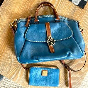Dooney and Bourke large satchel and wallet set. Preowned. Denim blue leather.